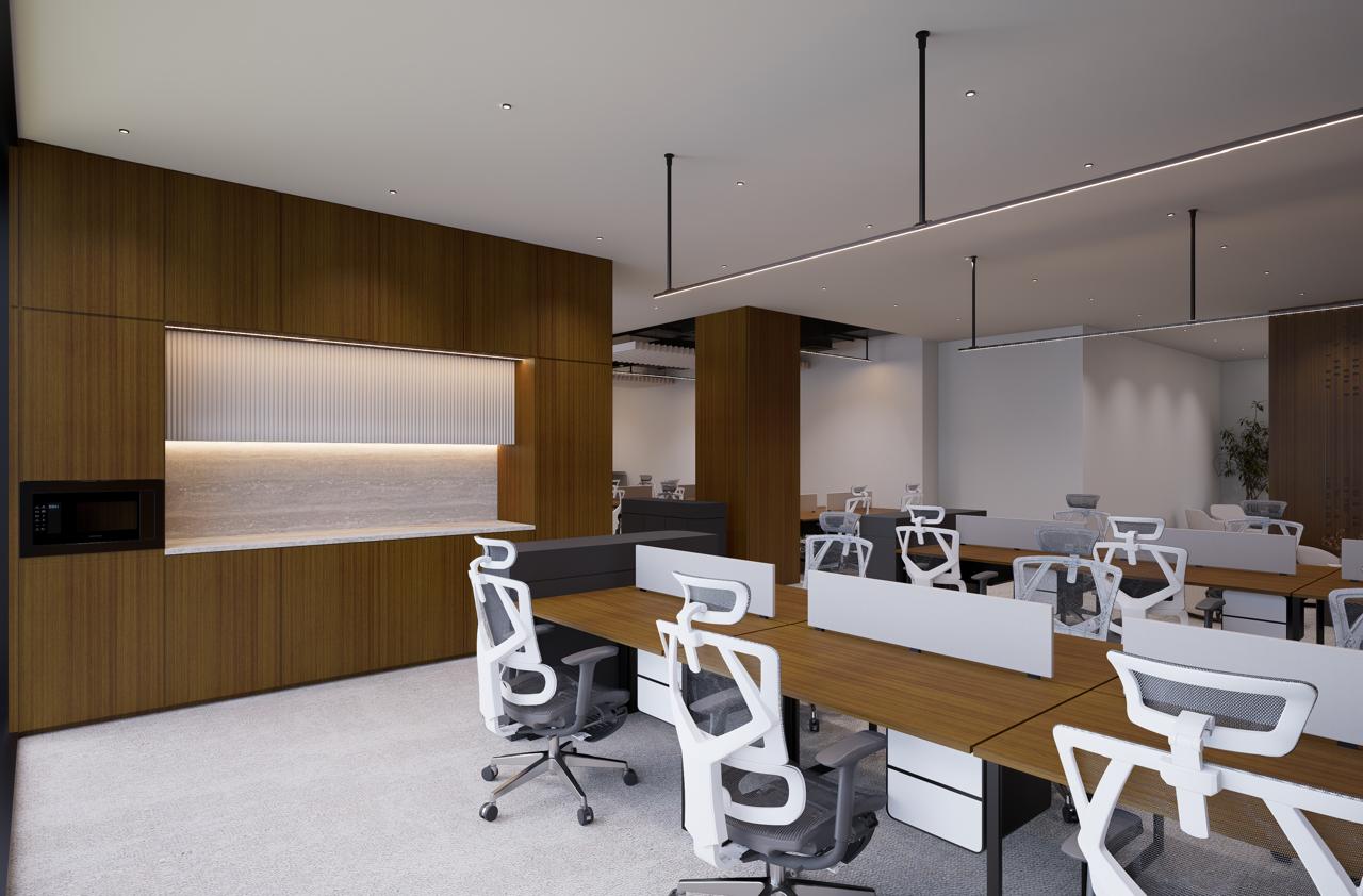 Open-plan serviced office in Dubai with modern workstations, task chairs, wood detailing, and built-in kitchen amenities.