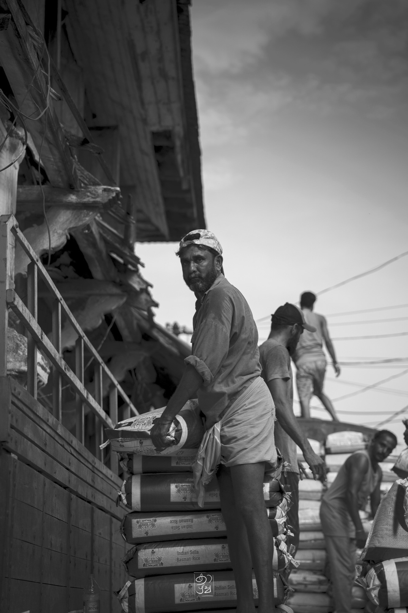 A porter carrying his load through the street