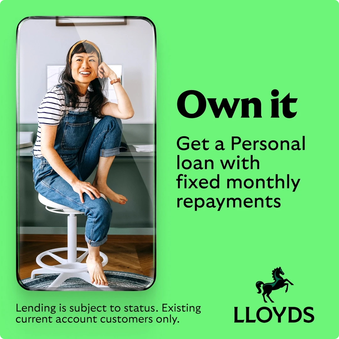 Lloyds Bank personal loan social media ad showing cheerful woman in denim dungarees and striped top sitting barefoot on office stool framed within smartphone graphic, bold 'Own it' headline promoting fixed monthly repayment personal loans on bright green background with Lloyds horse logo