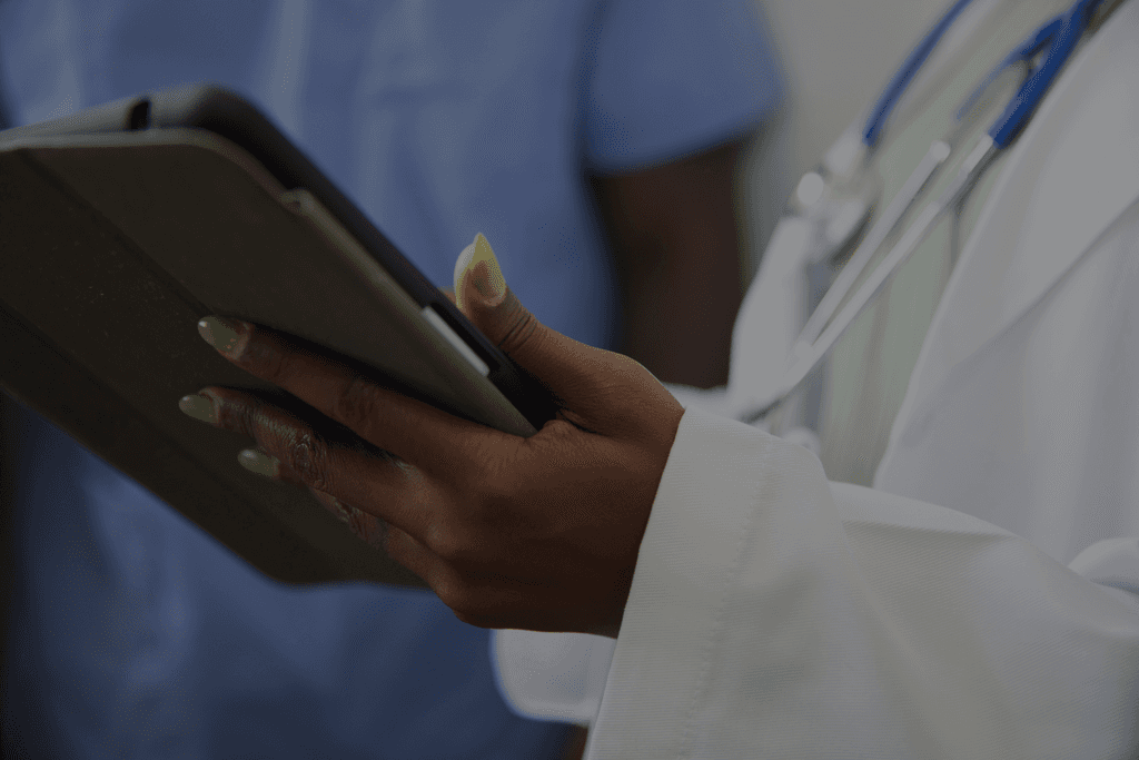 a doctor using a tablet
