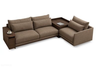 A living room featuring a spacious sofa with coordinated cushions