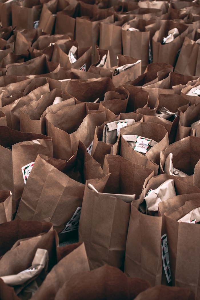 Rows of packed grocery bags ready for distribution