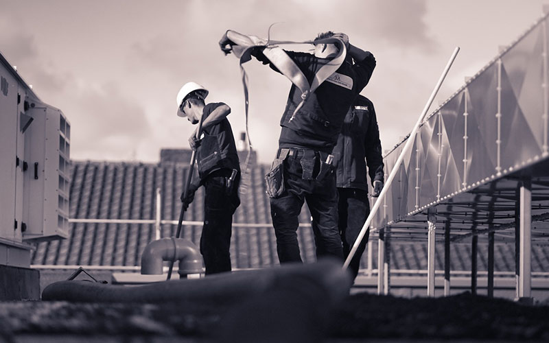 Two men looking at a laptop together