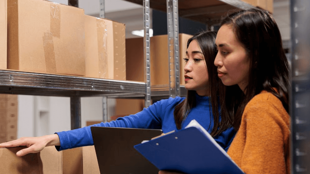 Two women checking out their inventory