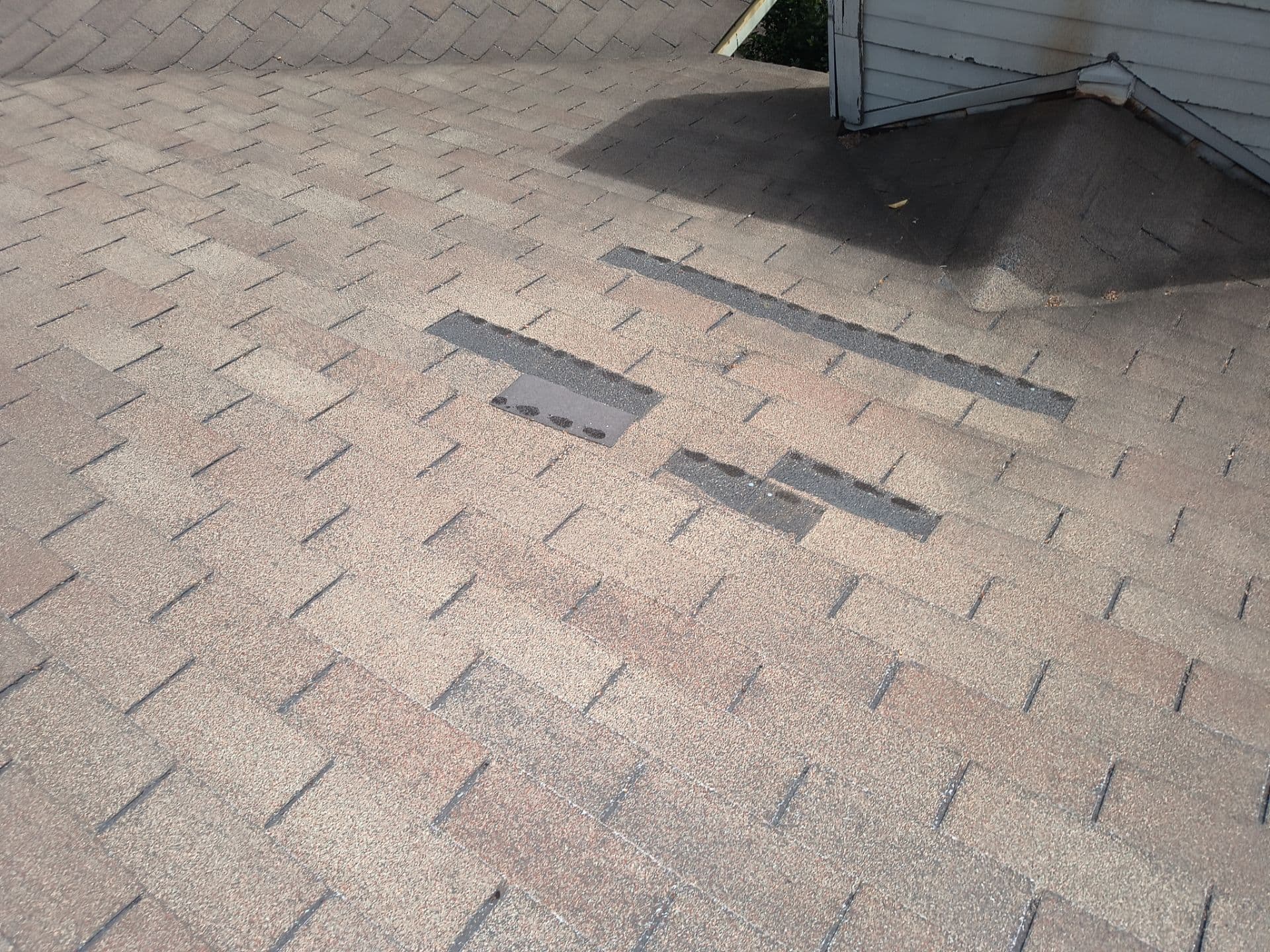 Wind damage to a Dallas roof