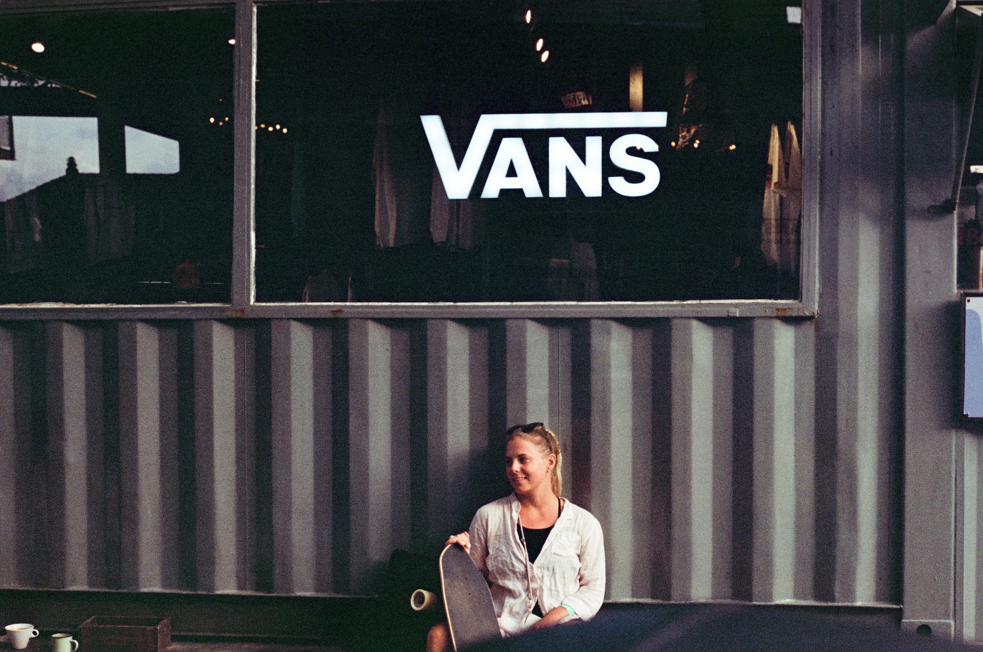 film photography of urban skate culture and skater girl at Vans shop