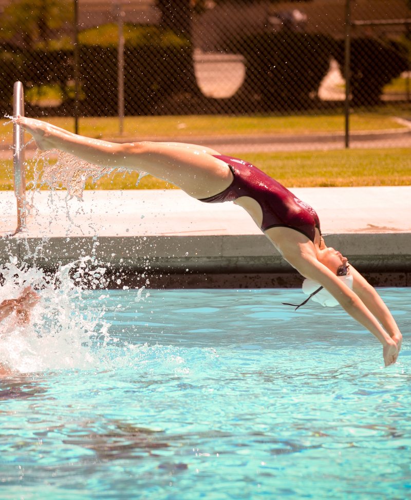 A Riverside Aquettes swimmer diving into Shamel Park Pool