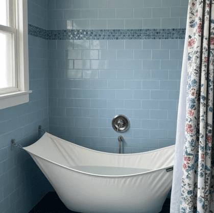 Beautiful woman holding a skin care product