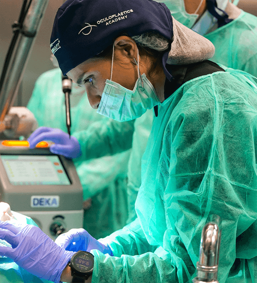 Aerial view of a winding road surrounded by dense green and yellow trees, showcasing nature’s vibrant colors.