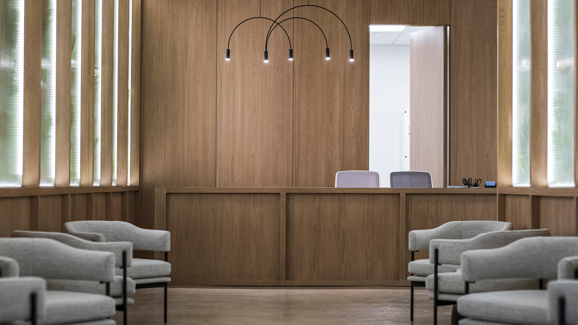 gray sofa chairs on brown wooden floor