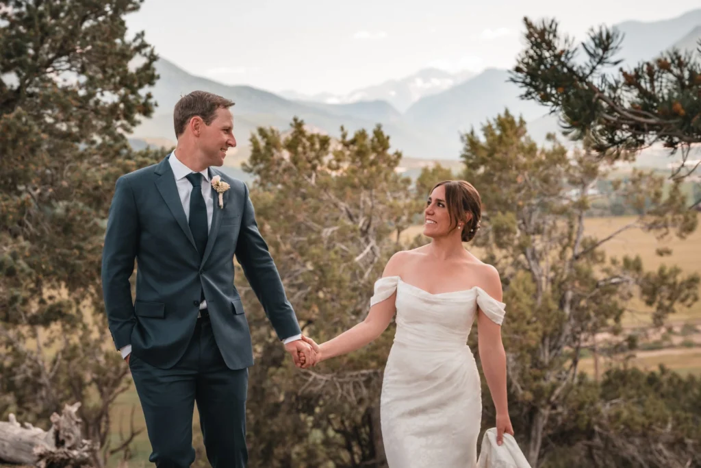 Couple walking together in scenic landscape at Carbondale Private Ranch Wedding