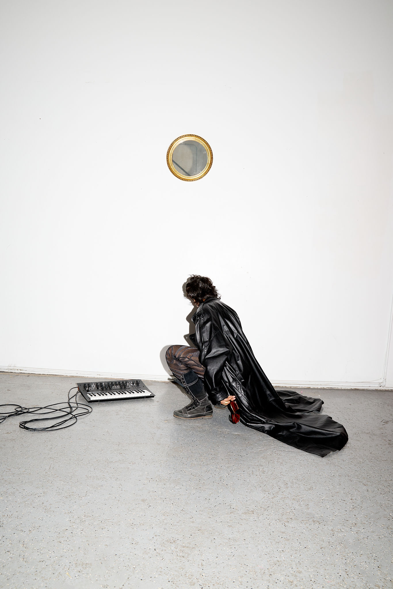 Woman with red hair covering mouth with hair