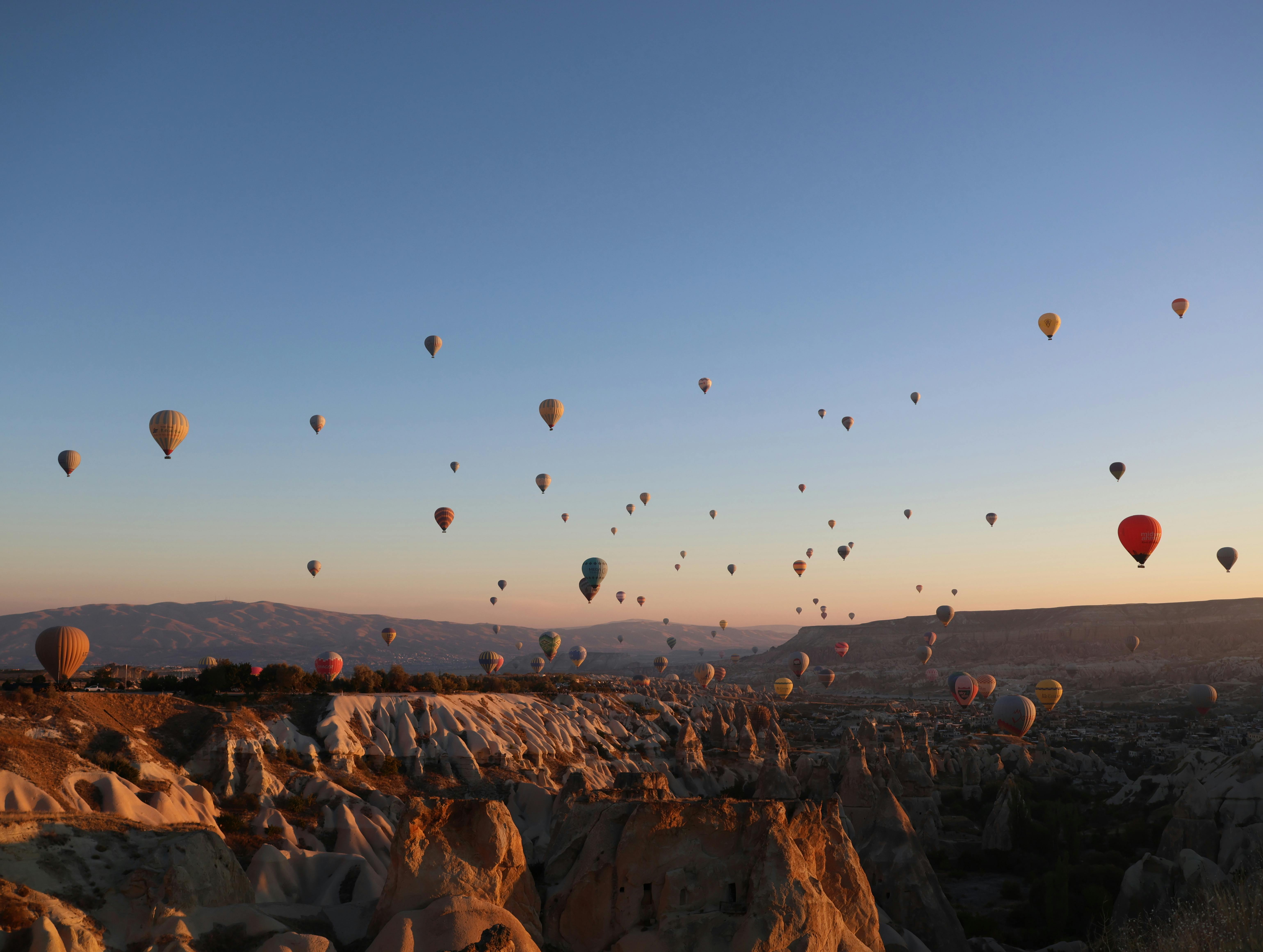 aerial view of village on mountain cliff during orange sunset