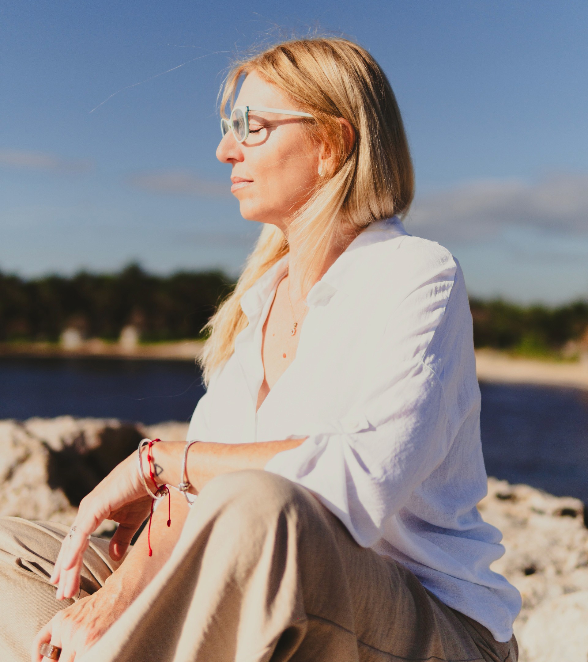 Two people doing a side stretch pose on yoga mats