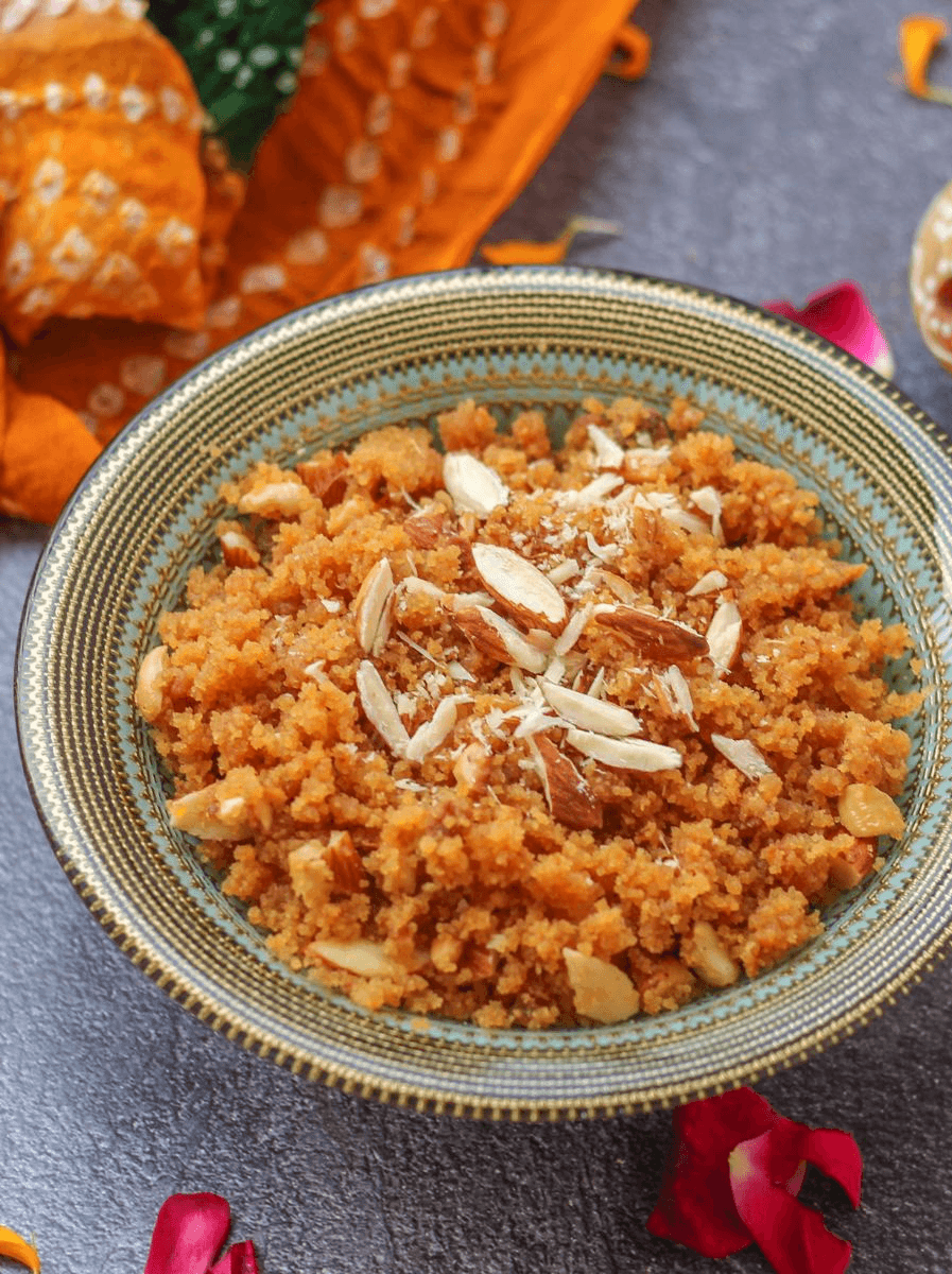 A hearty holiday side dish, possibly a potato salad or mash mixed with greens and herbs, heavily garnished with fresh dill, served on a gray plate amidst a festive table setting with fir branches and a lit candle.
