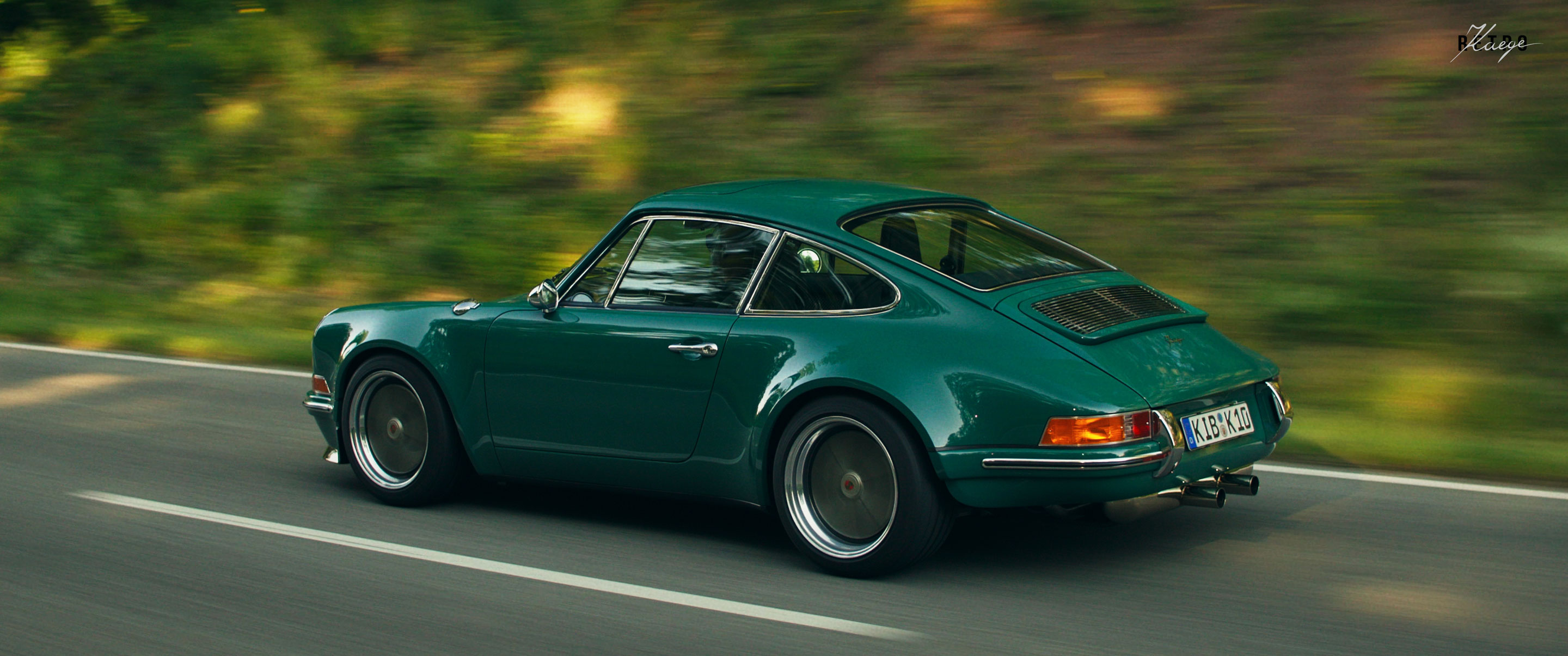 a green retro porsche