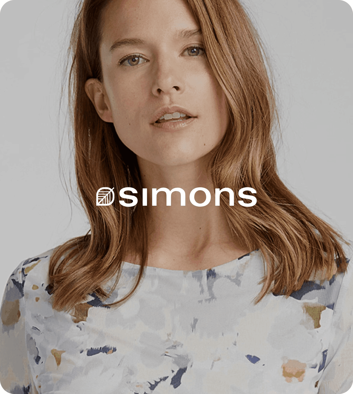 woman wearing a watercolor-print shirt from simons