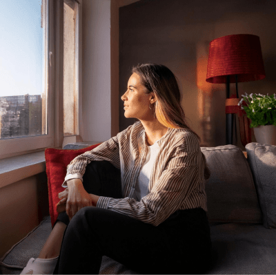 Relaxing on the couch, watching the city outside.