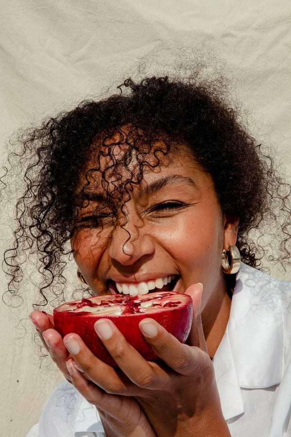 happy woman taking a bite 