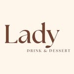 A person on a white shirt and black coat standing at the window indoor of the office