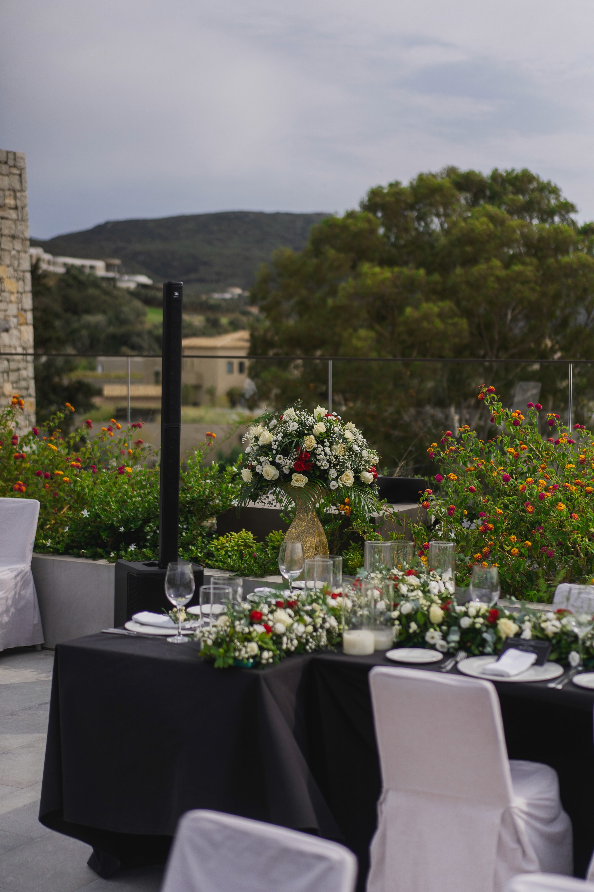 Rustic wedding decoration featuring a wicker basket filled with white lilies and greenery