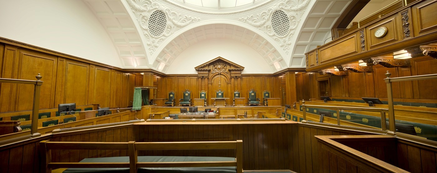 An empty courtroom with wooden panelling