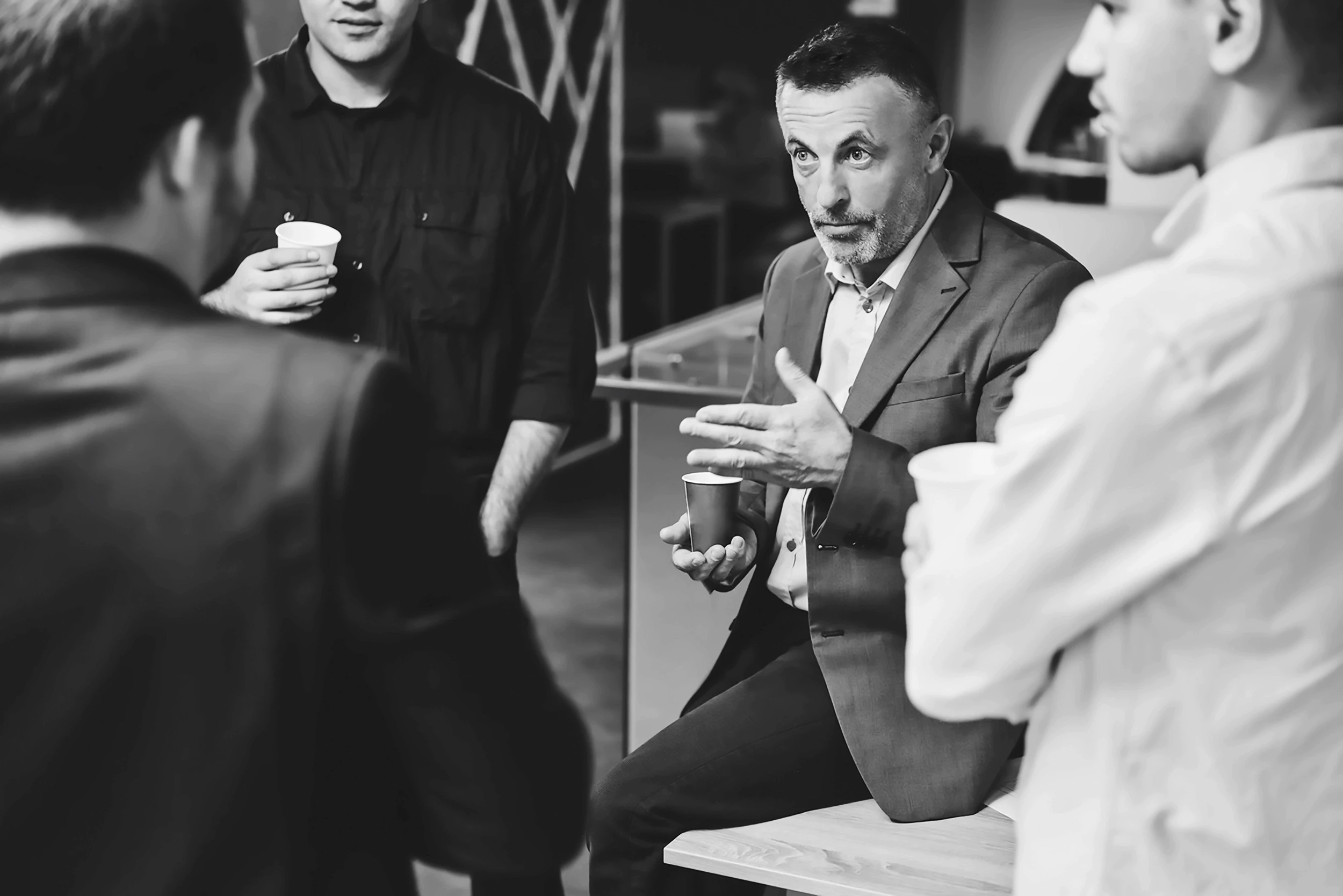 Woman holding a smartphone looking through the glass 