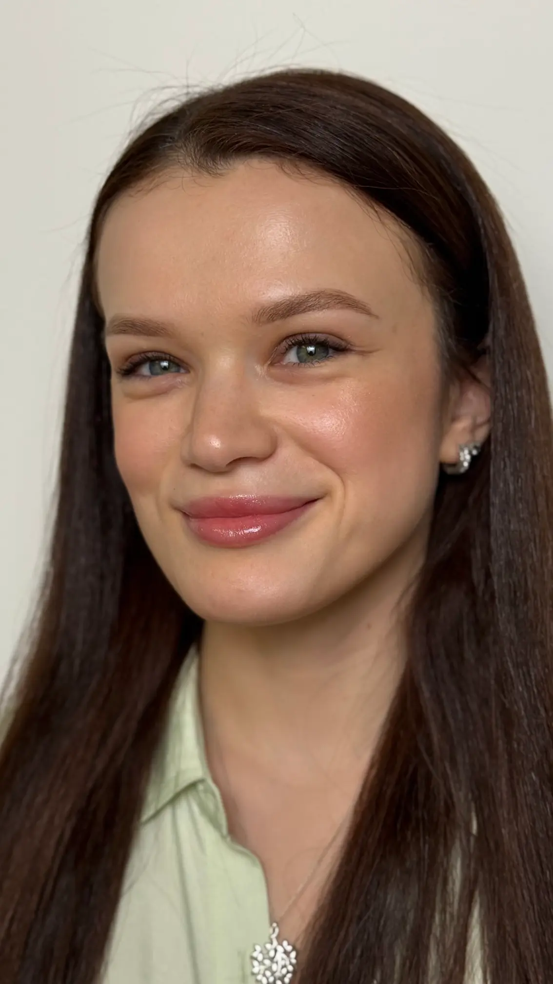 Smiling client after permanent makeup session