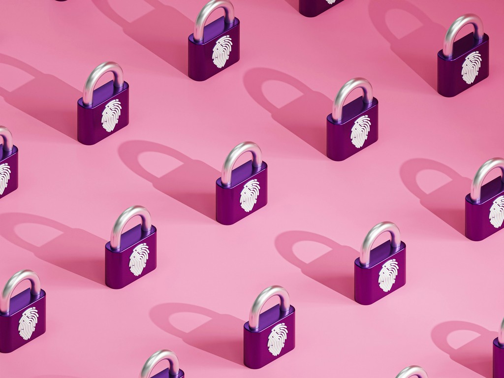 A pattern of purple padlocks with fingerprint symbols is arranged on a pink background. The repetitive design emphasizes themes of security, privacy, and biometric protection, symbolizing the importance of safeguarding information through modern security measures.