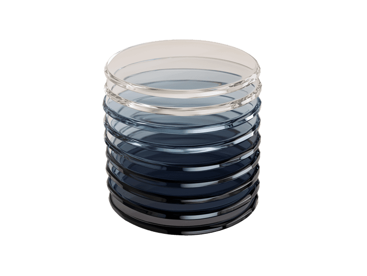 stack of glass discs fading from clear to dark navy blue