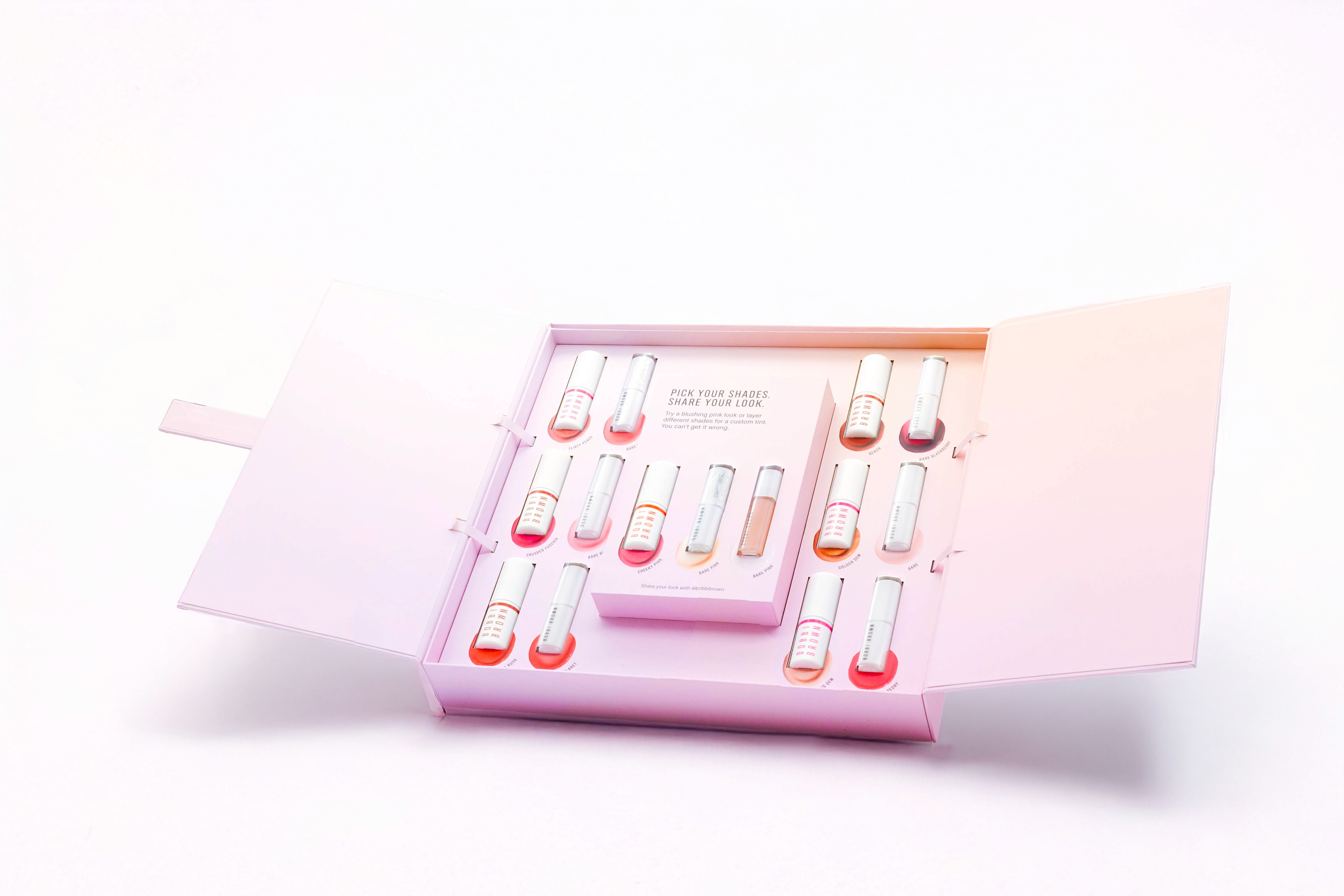 Stack of modern books and magazine with minimalist cover design on leather chair