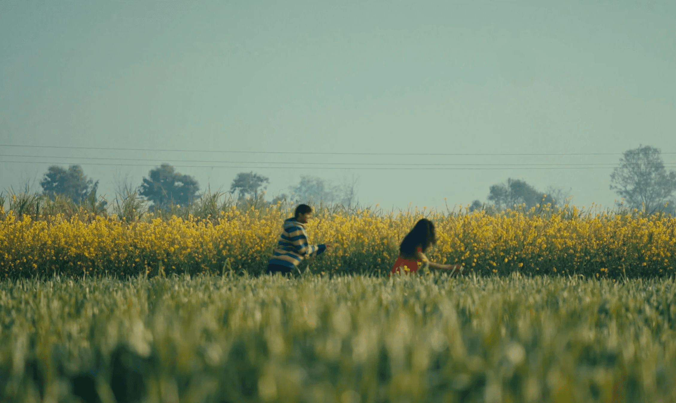 Man silhouetted against a bright orange light