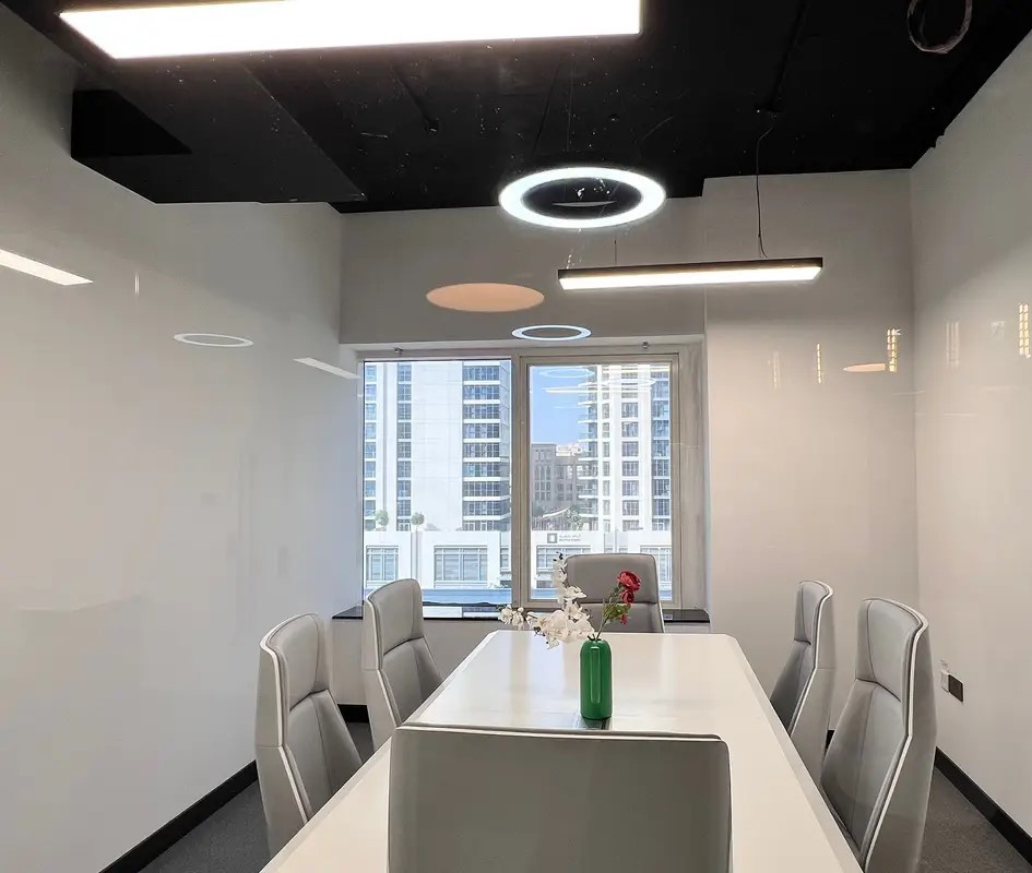 Elegant conference room with city views, designed for high-level business meetings and professional services.