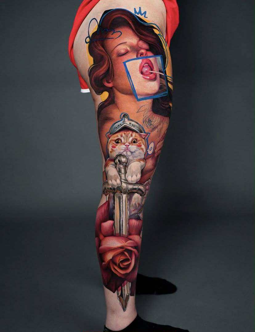 Leg tattoo with celestial and geometric patterns.