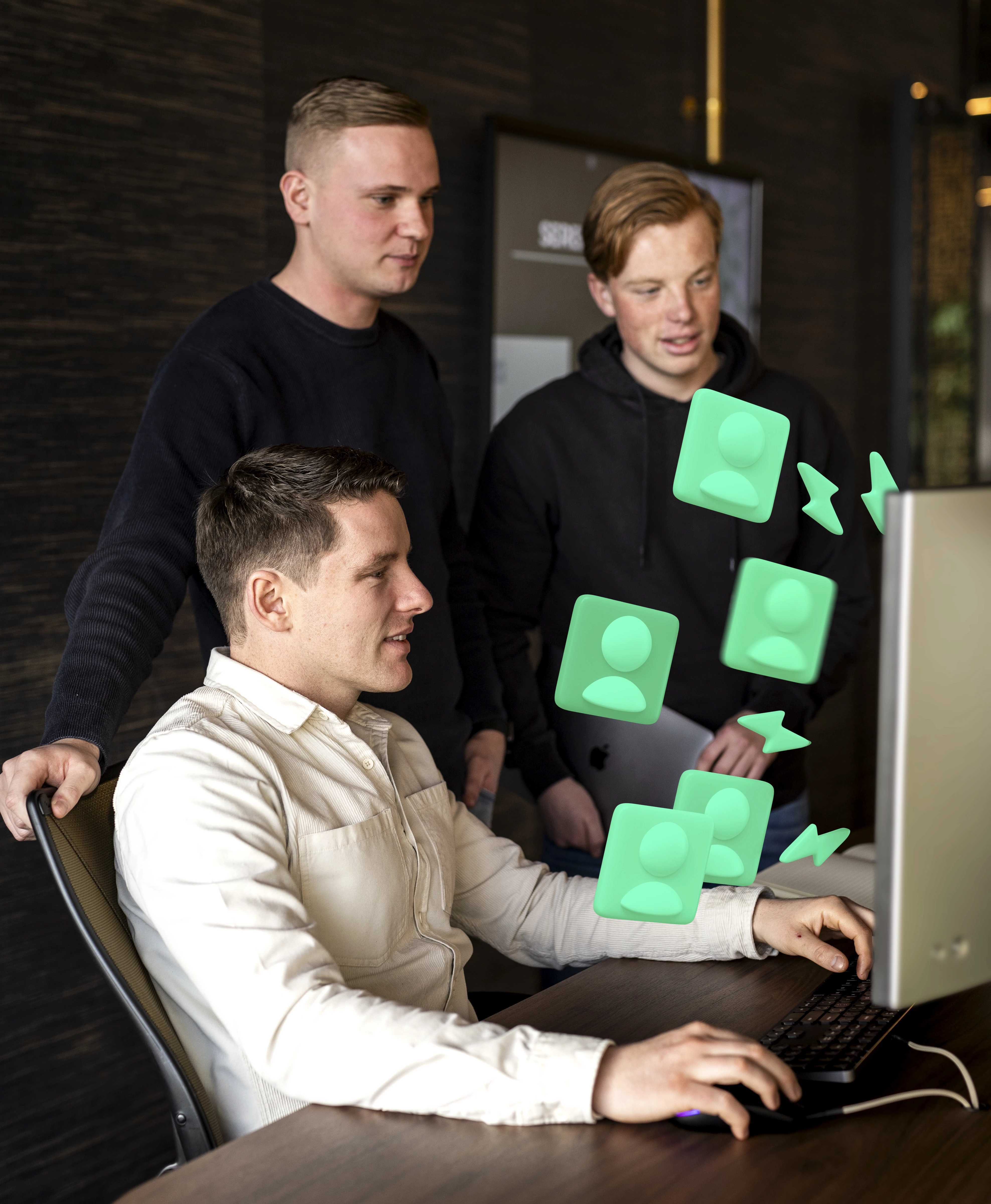 A woman stands in an office, with social media icons emerging from her laptop, symbolizing digital connectivity and engagement.