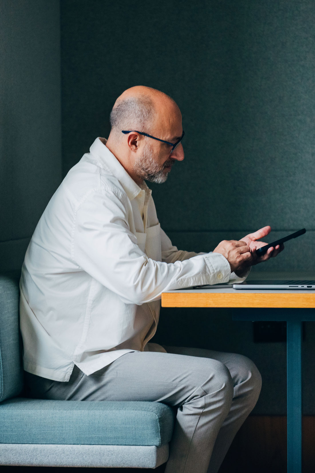 H1B visa lawyer reviewing documents on tablet in office