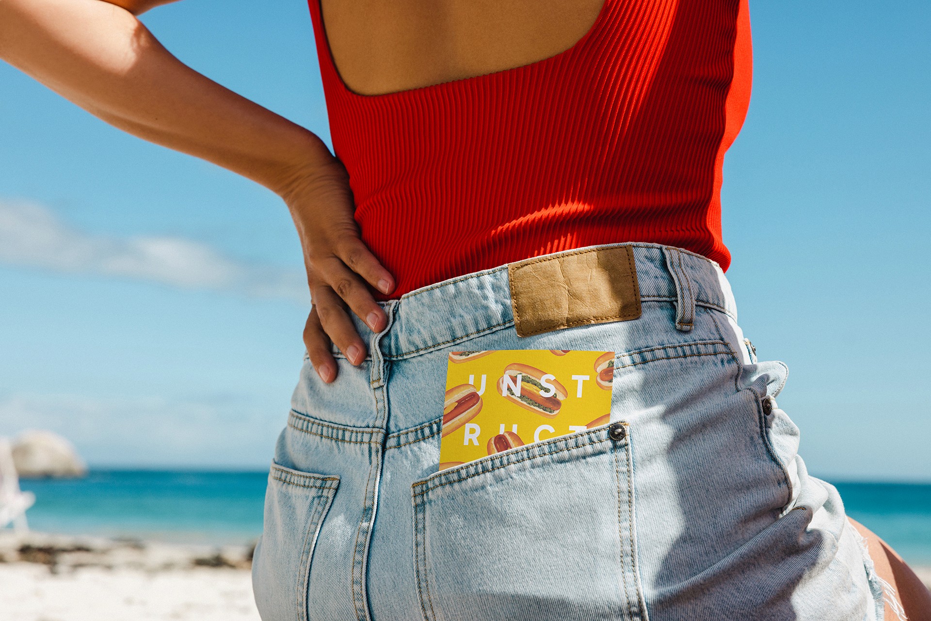 Unstructured sticker in jeans pocket of a woman