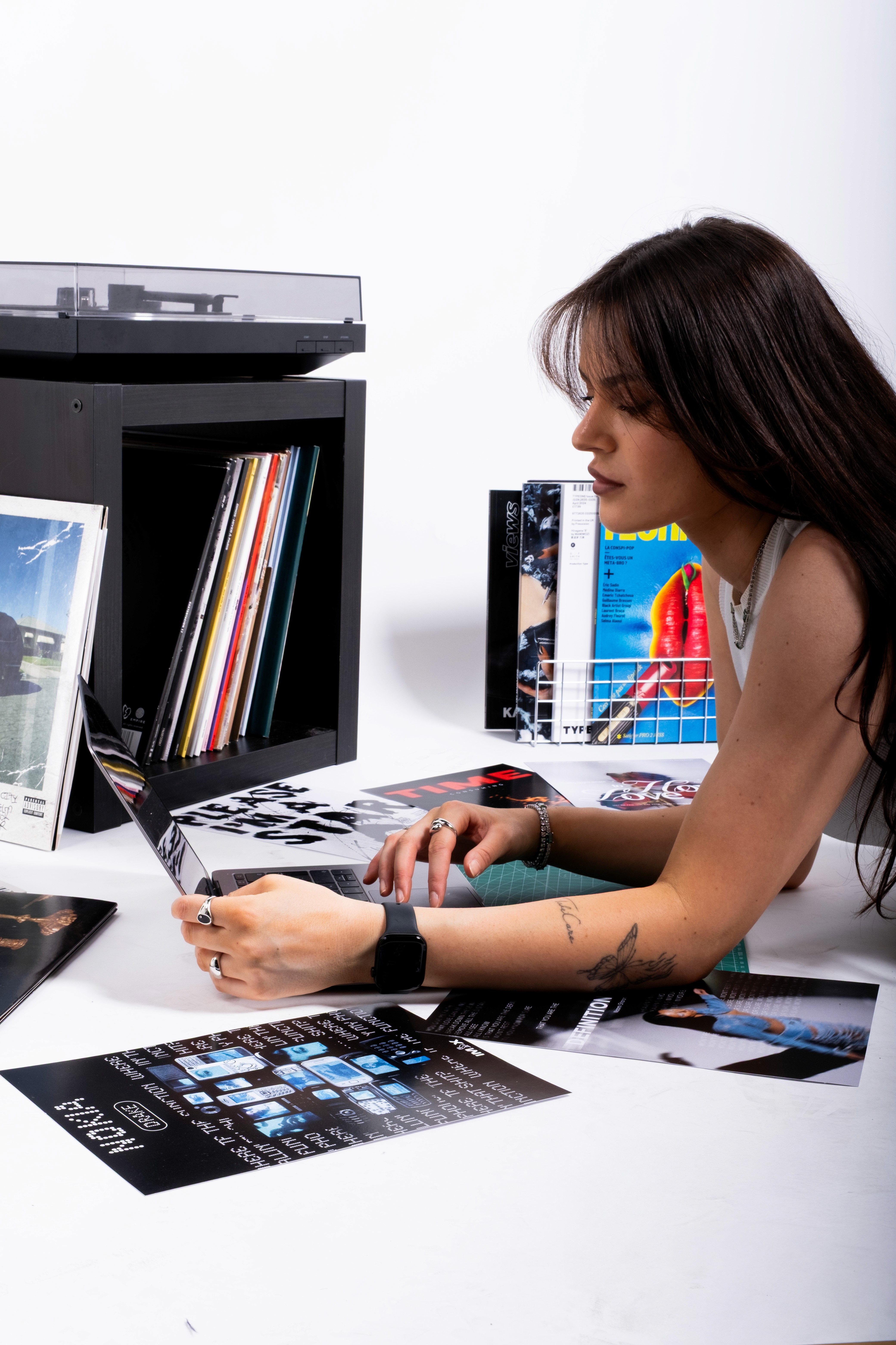 Minimalist brushed-steel chair in a white corner studio—industrial, brutalist modern furniture.