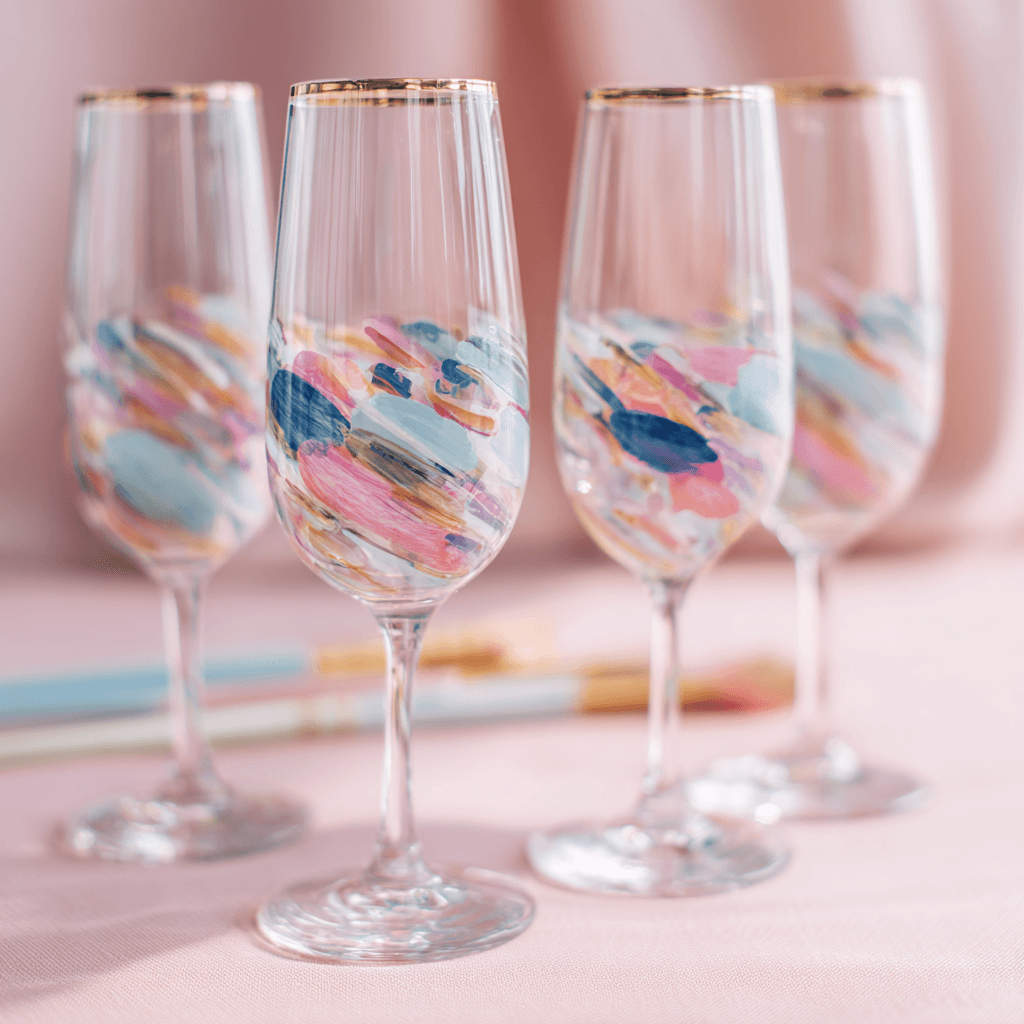 Champagne glasses on a blush table, evoking Prepared Travel’s curated bachelorette parties with refined style and joyful detail.