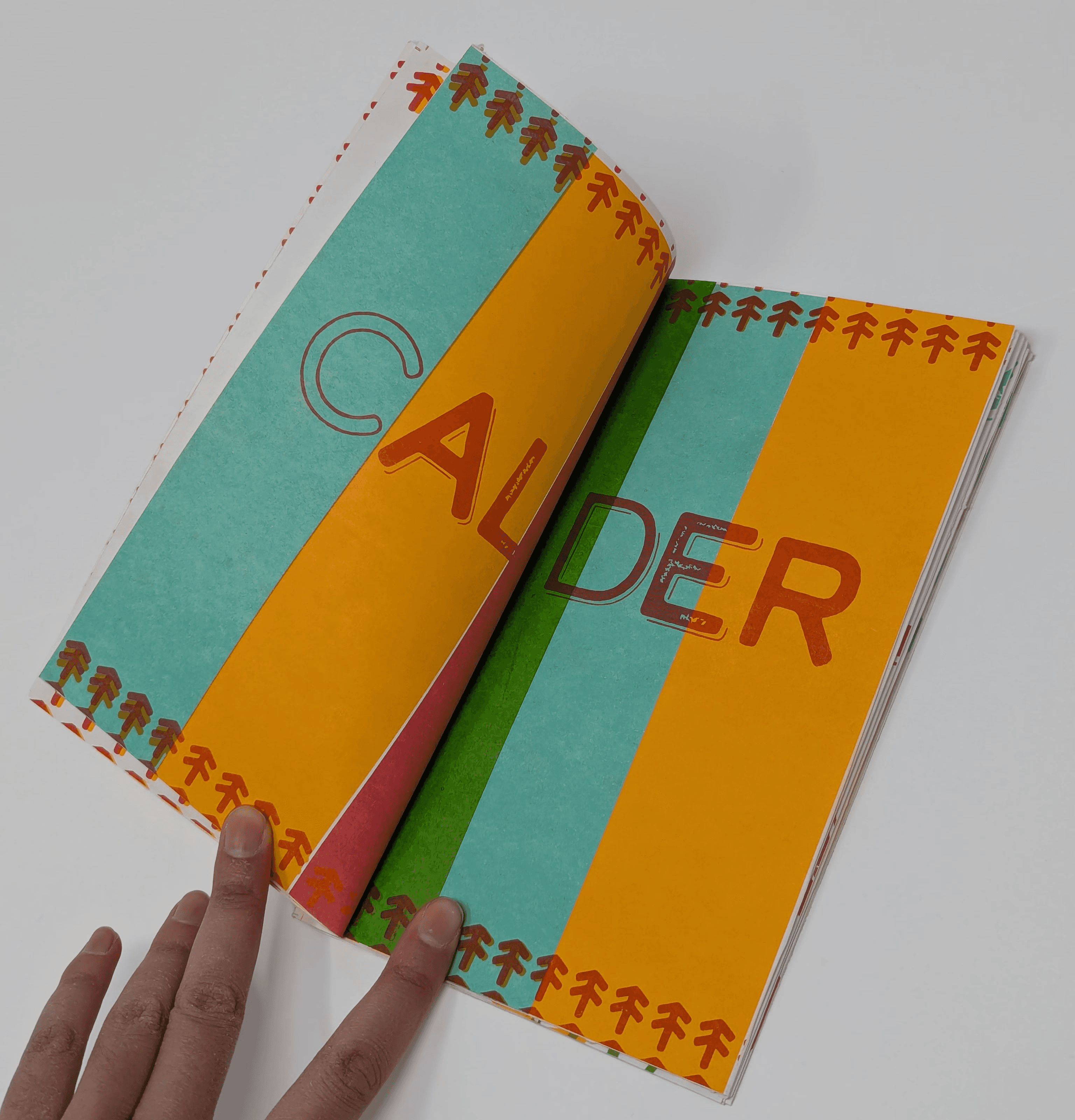 inside page, displaying the typeface "Calder" with columns of colors.