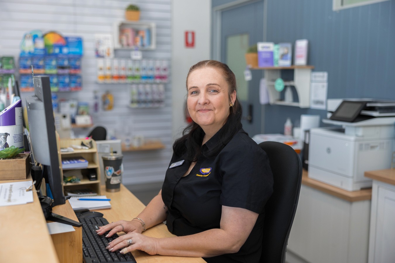 Receptionist sitting at computer