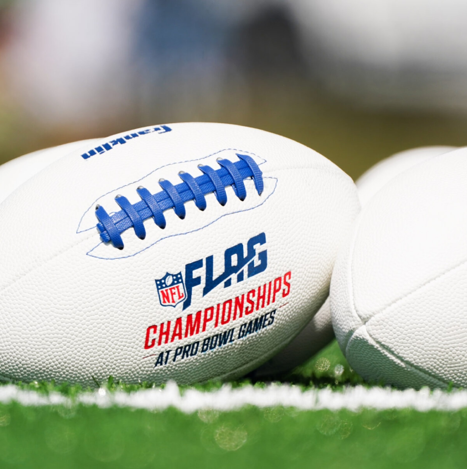Stacked pink and red glass cosmetic jars on white—minimal skincare packaging display.