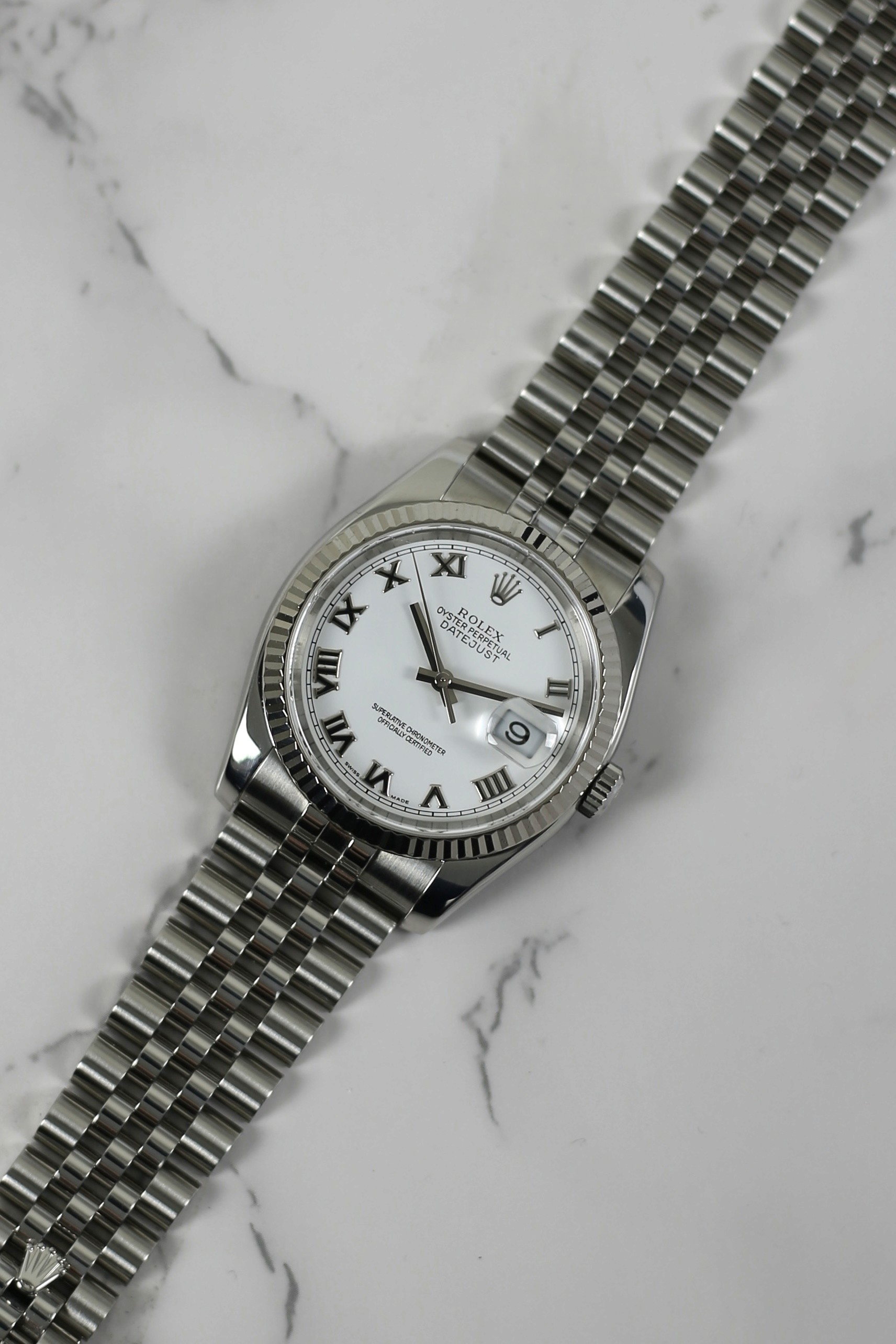 DATEJUST WHITE ROMAN 18K WHITE GOLD BEZEL HIDDEN CLASP JUBILEE