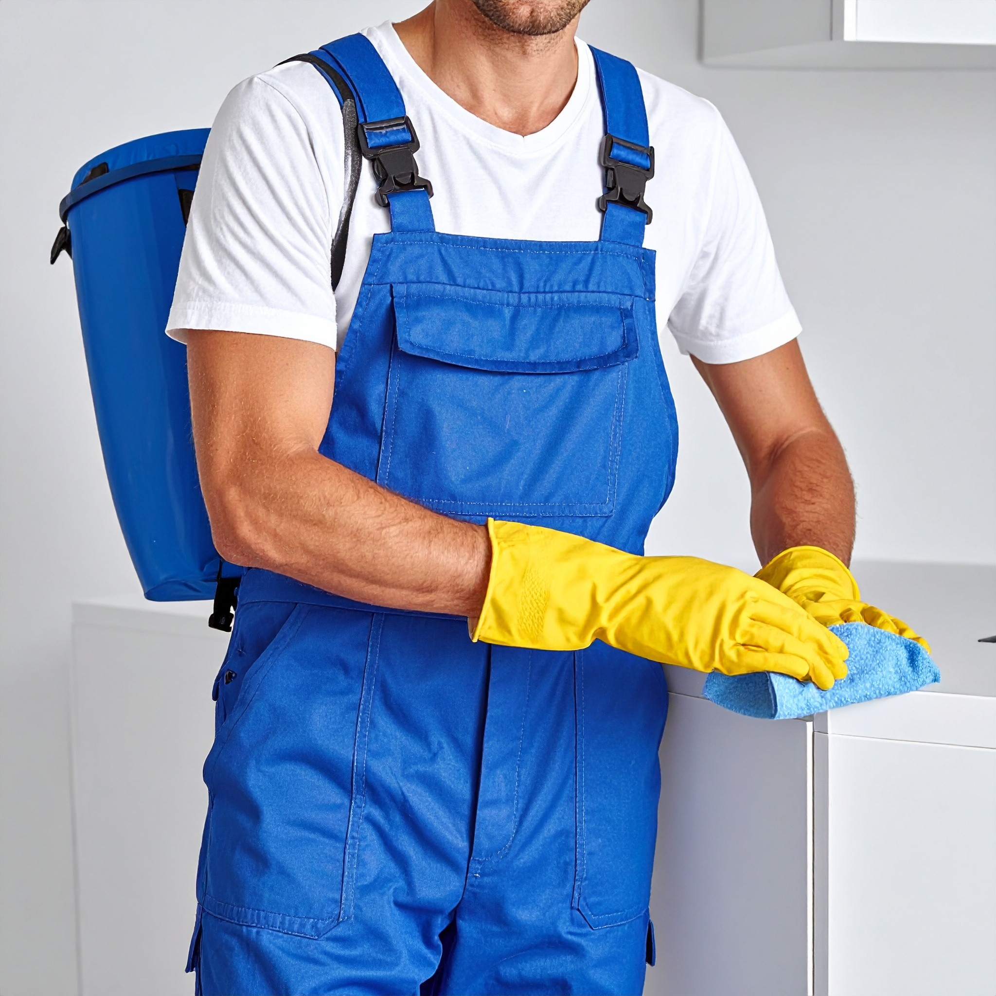 man cleaning furniture