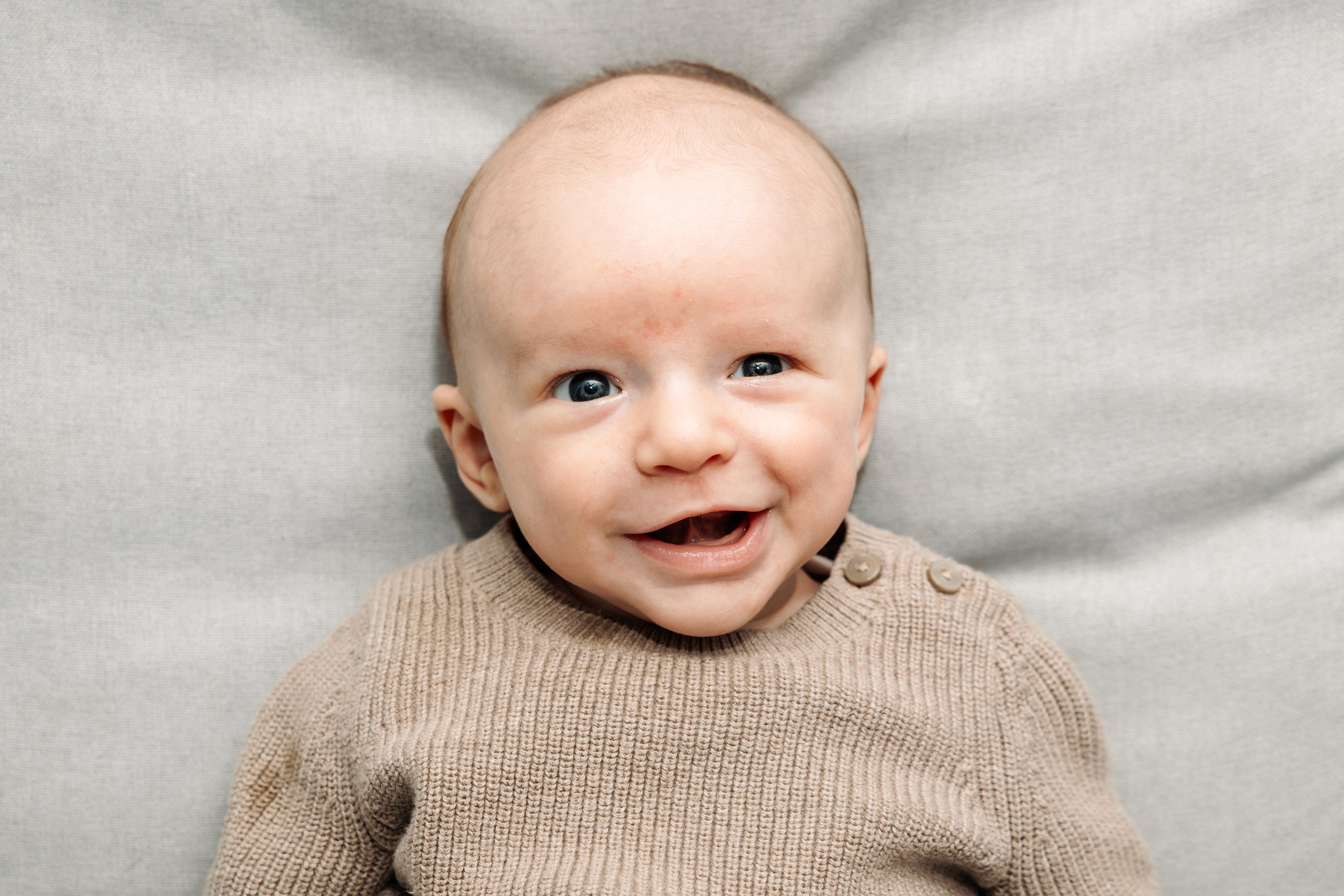 4:59 PMCouple caught in a genuine laugh on the stairs at Bethesda Fountain in Central Park, NYC — fun, unposed couples photography by Lizz Spano Photography, New York City couples photographer.