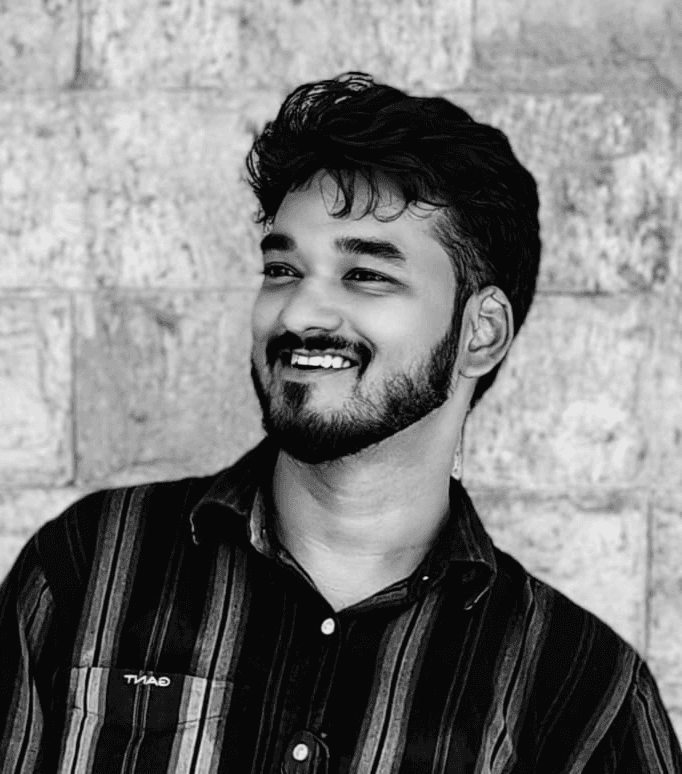 a blurry photo of a person standing in front of a wall