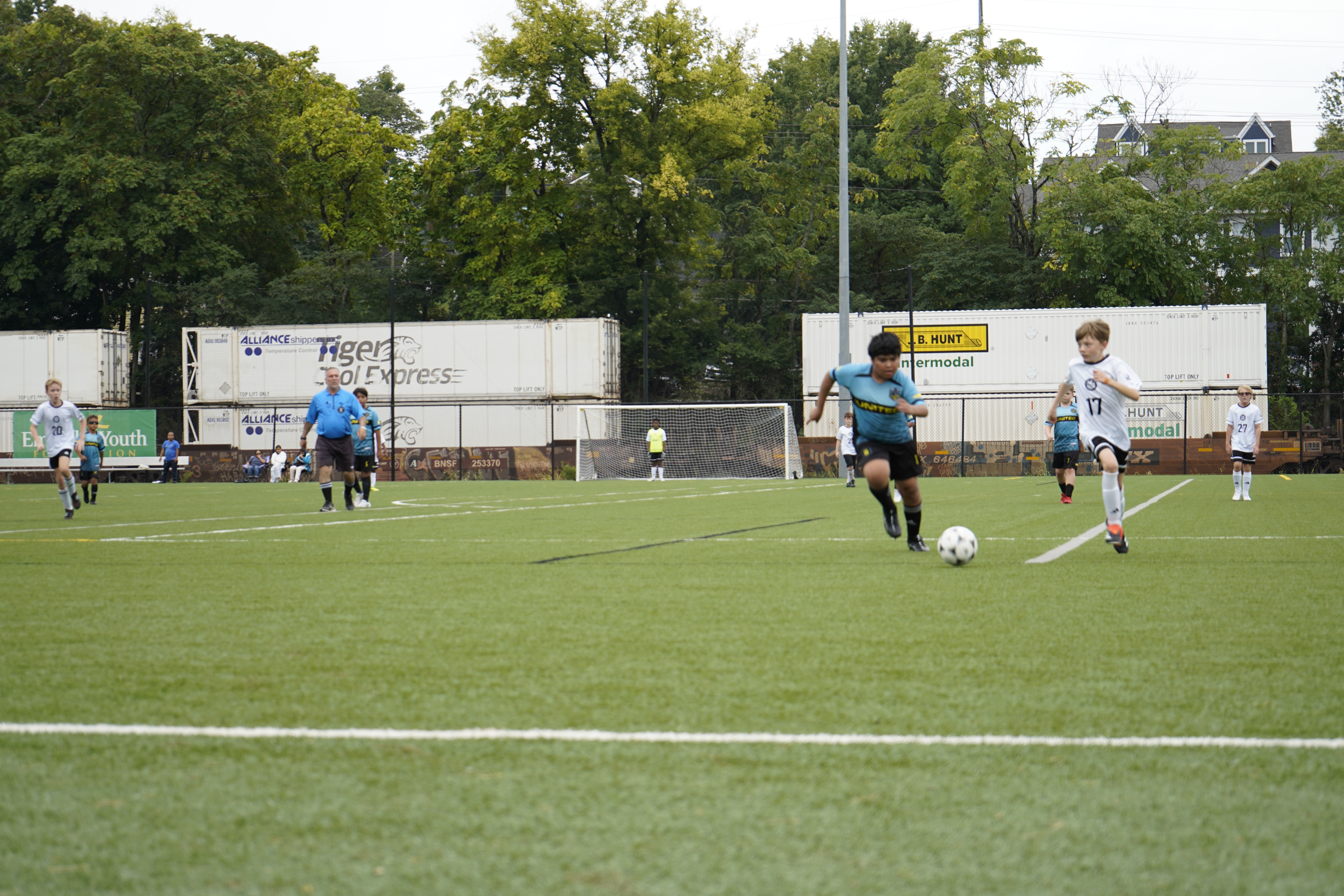 A man standing with Sufboard
