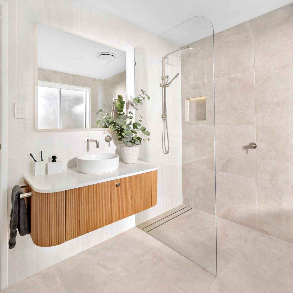 Riverside bathroom with custom vanity, shower layout and refined finishes