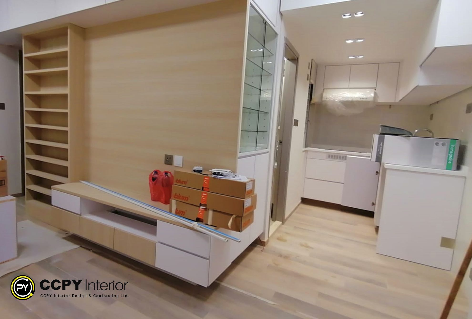 Functional and elegant hallway at Mount Pavilia with floor-to-ceiling white storage and a slim dark console table for aesthetic utility.