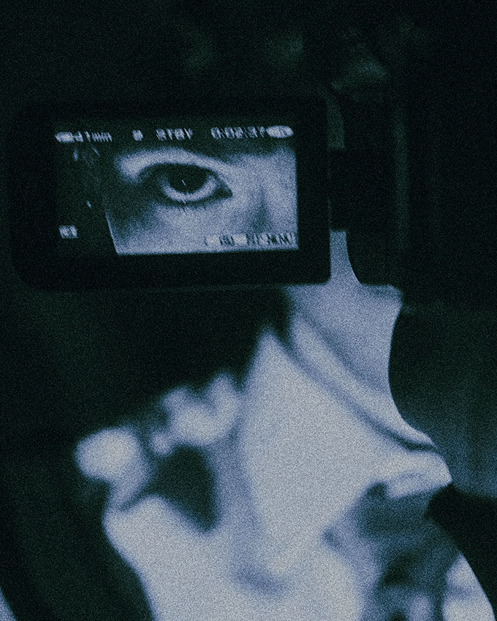 Woman with red hair covering mouth with hair